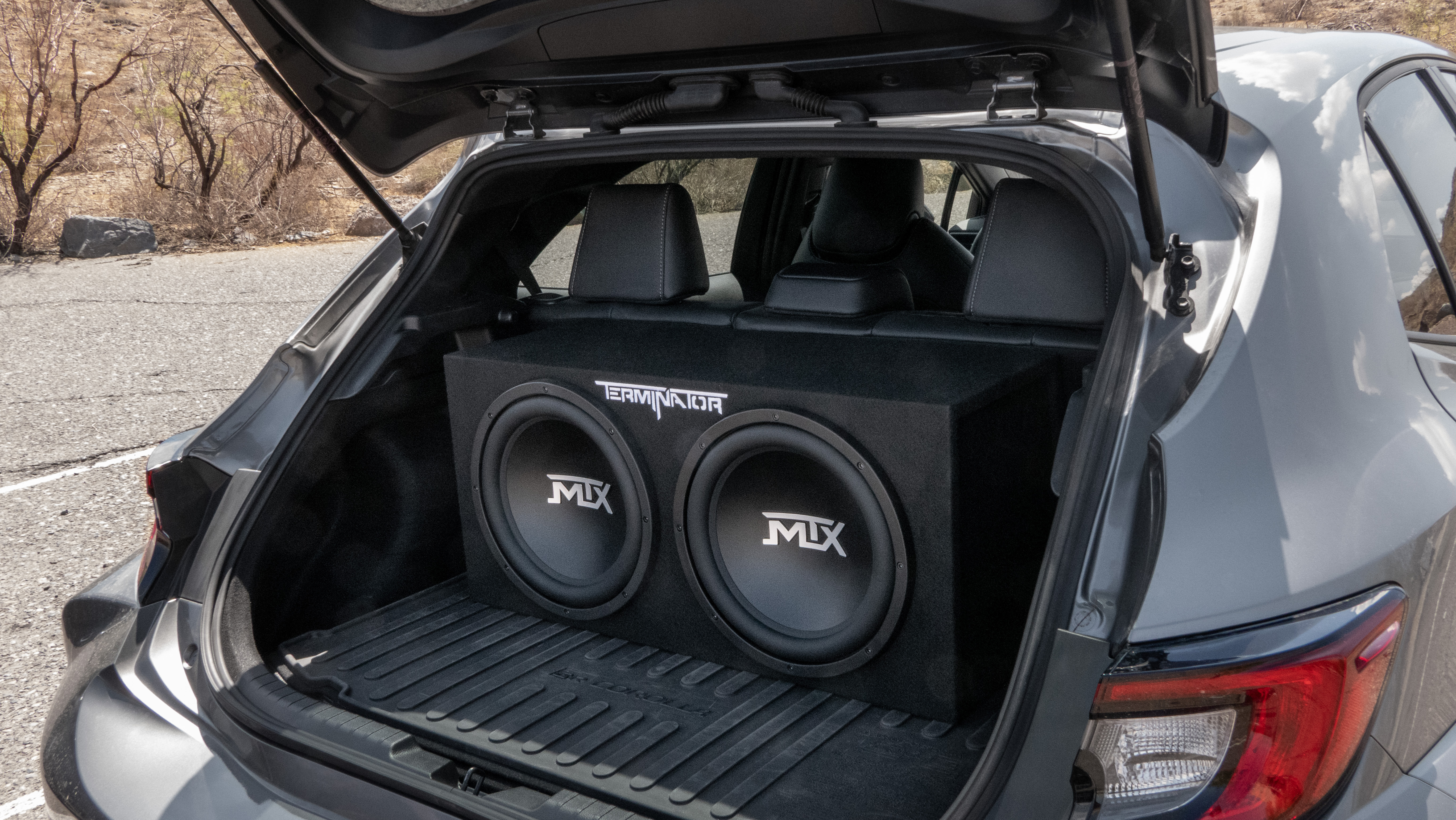 MTX Terminator subwoofer enclosure installed in vehicle trunk